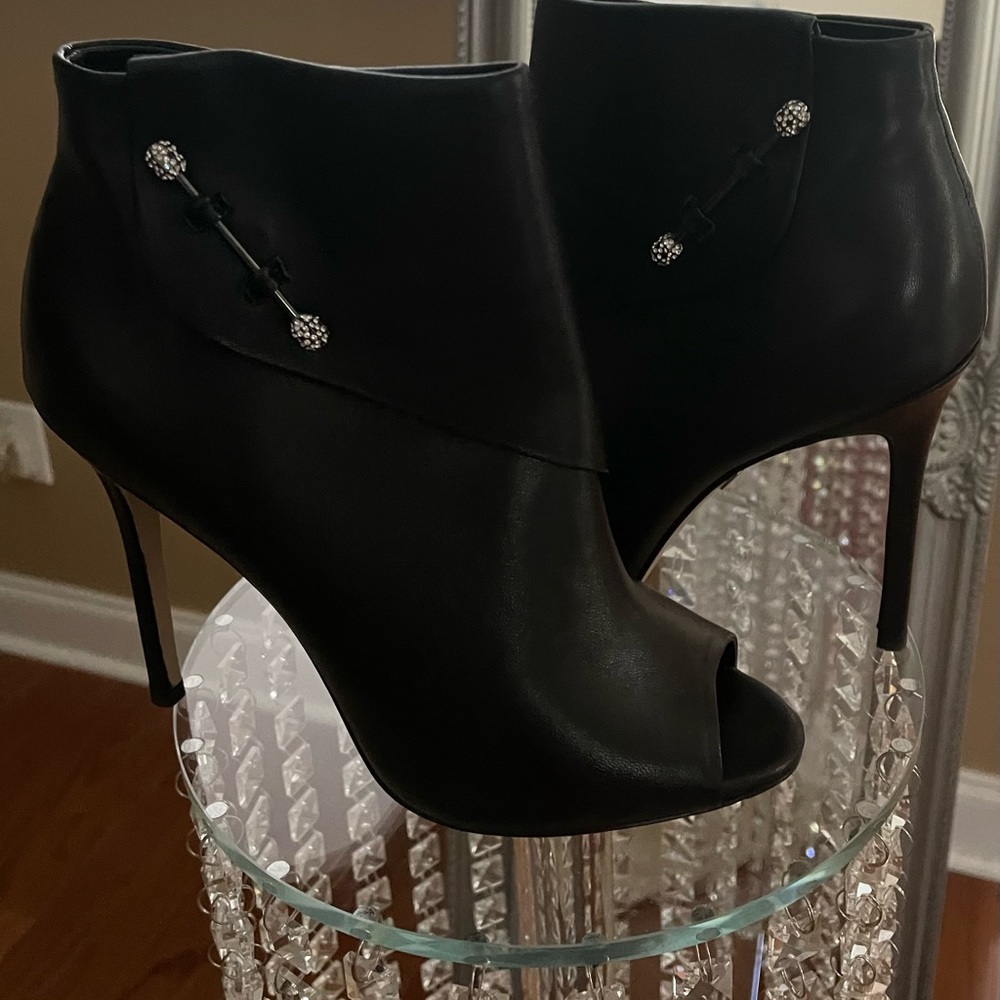 Black peep toe booties. Excellent condition, rhinestones accented side bow.